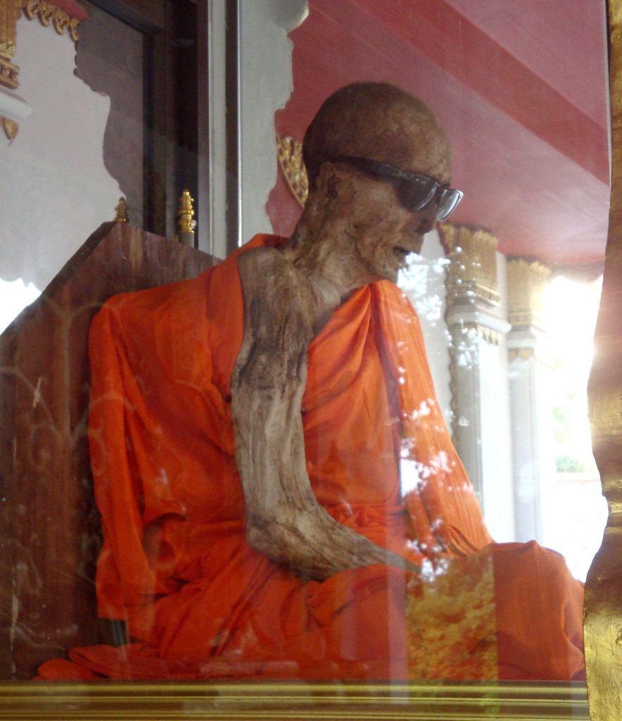 The mummified remains of Luang Pho Daeng a Thai Buddhist monk who died while meditating during the mid-1980s.