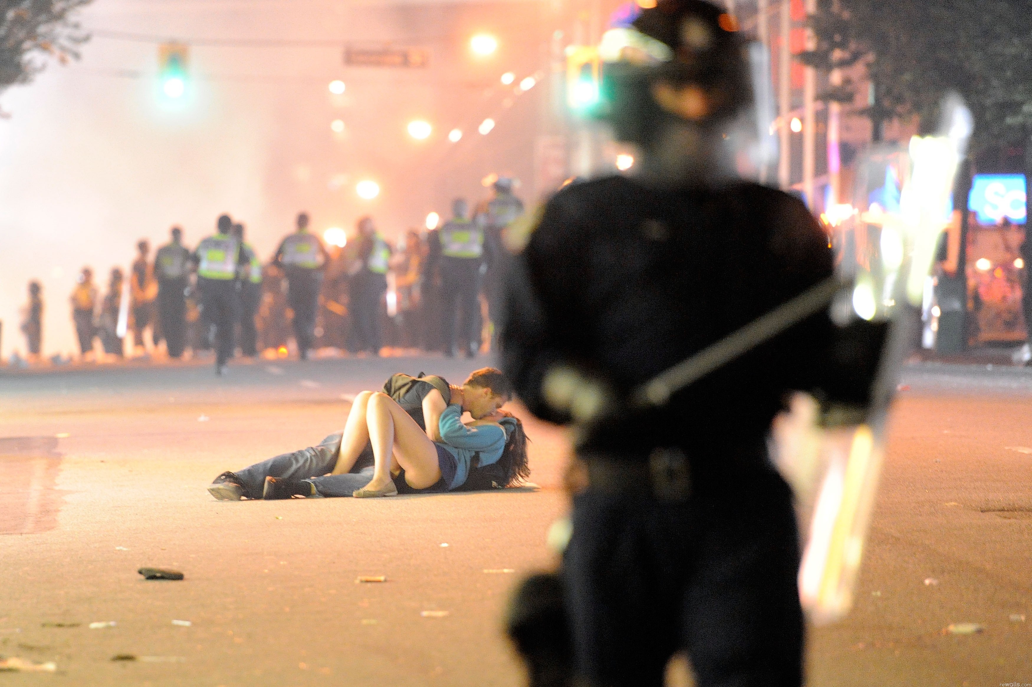 A couple kisses on the pavement during the Vancouver Riot. 2011