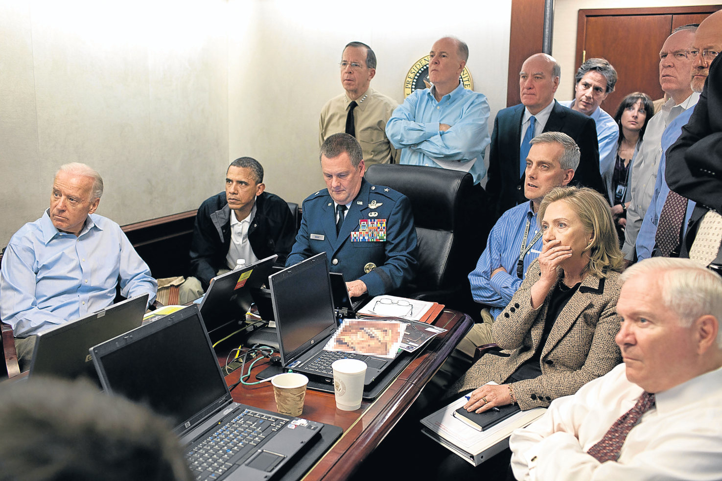 Barack Obama and Government staff watch as commandos conduct a raid, which ends with the killing of Osama bin Laden. 2011