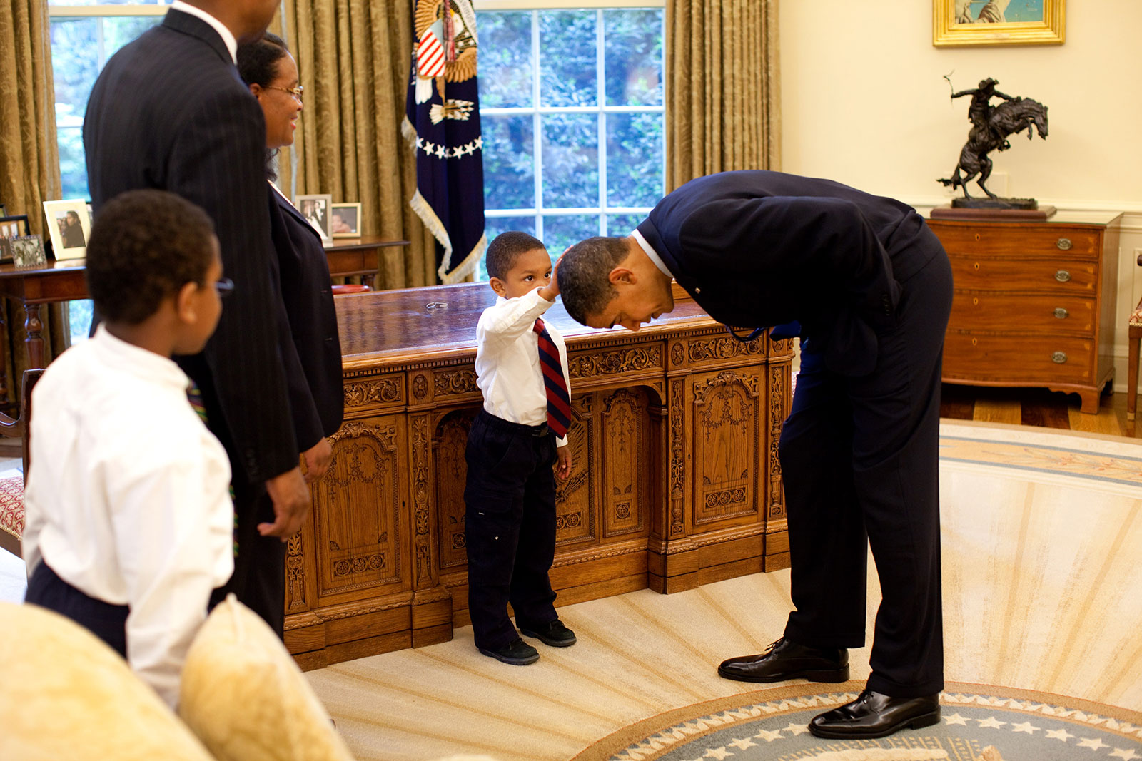 Jacob Philadelphia touches the hair of Barack Obama to see what it feels like. 2009