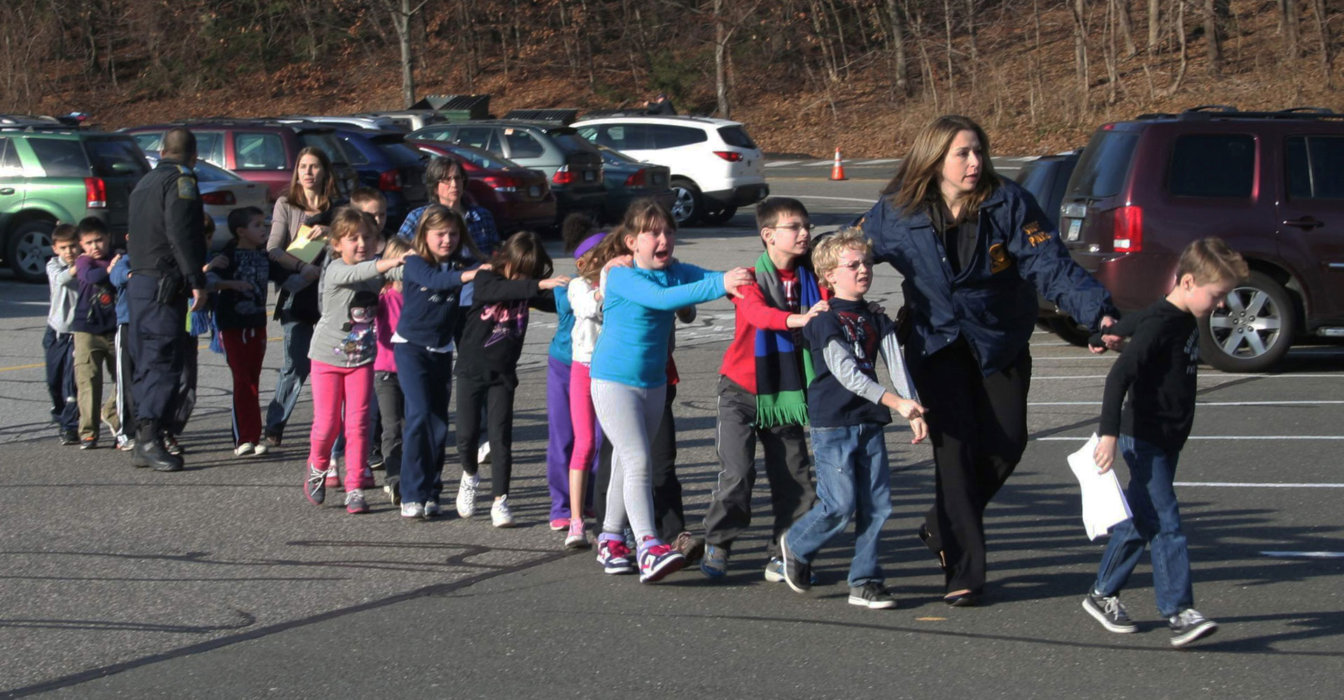 The children of Sandy Hook are escorted from the site of the school shooting. 2012