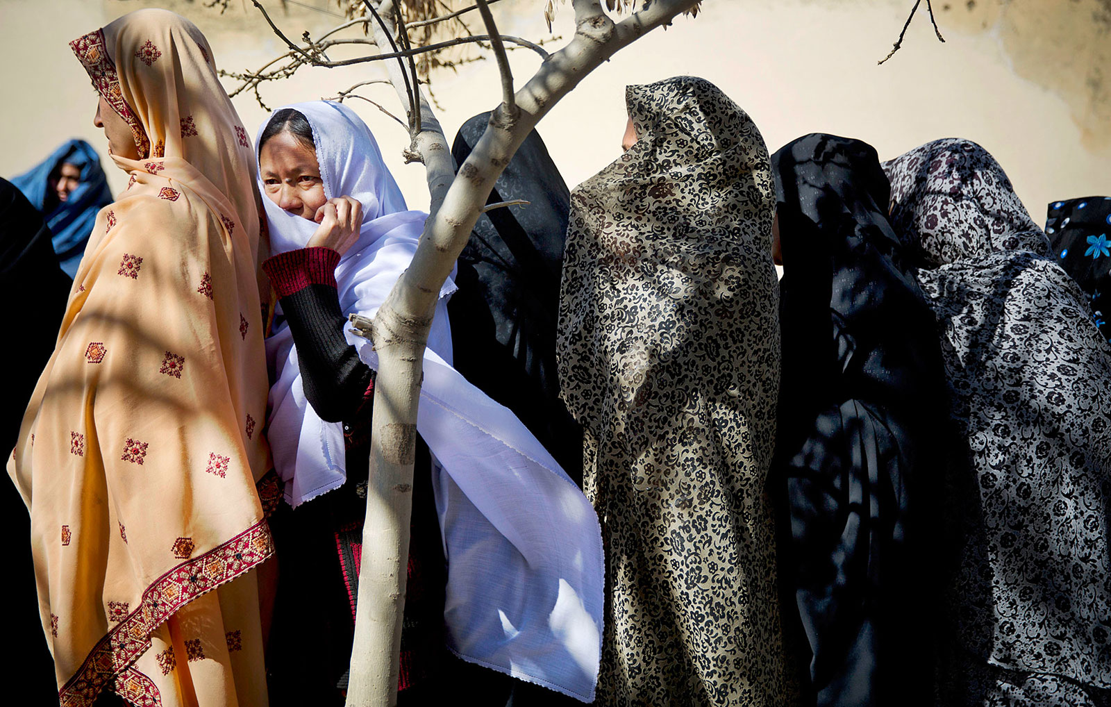Afghan women turn out to vote in the first democratic transfer of power the country has ever seen. 2014