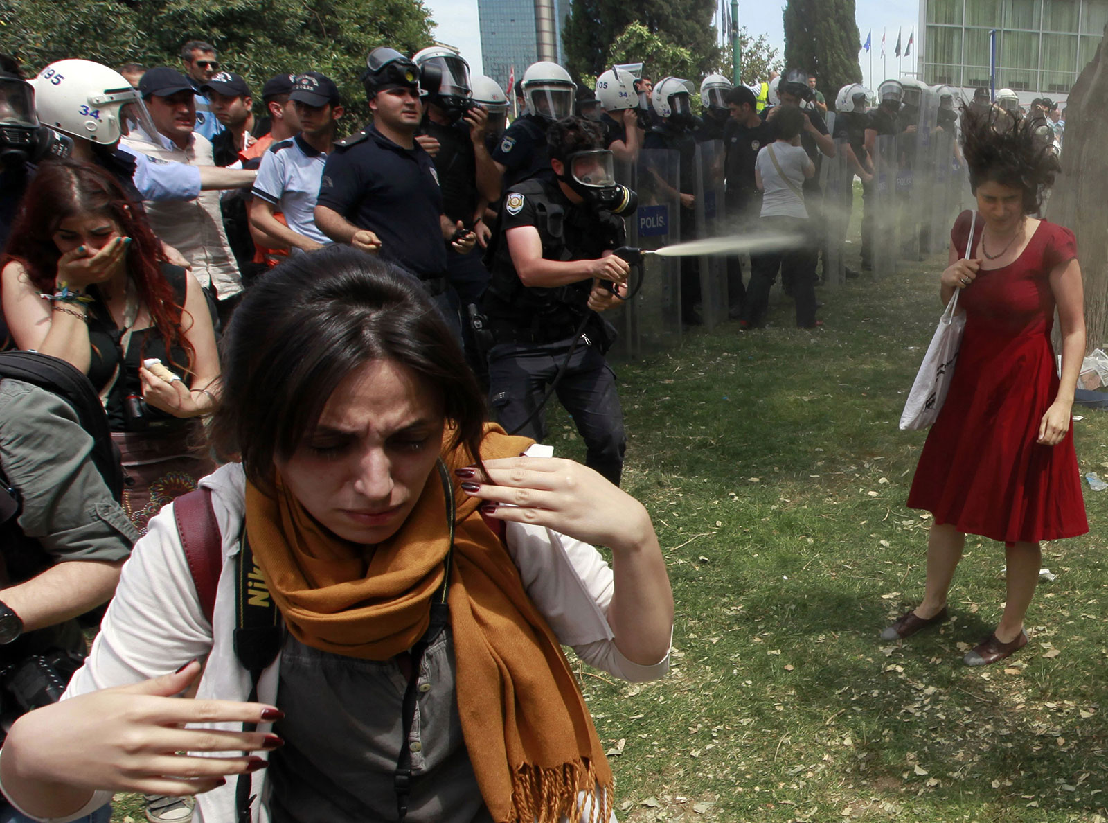 A woman is peper-sprayed at Turkey's Gezi Park protest. 2013