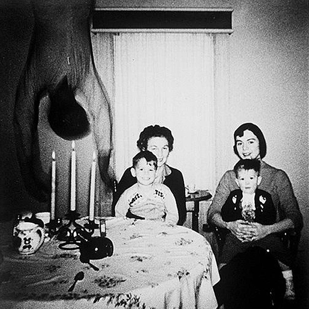 As the Cooper's move into their new home in Texas, they take a photograph of the family sitting together, but as the photo is taken, a body falls from the ceiling. The OP said he wasnt sure if it was real, but he thought it was real creepy.