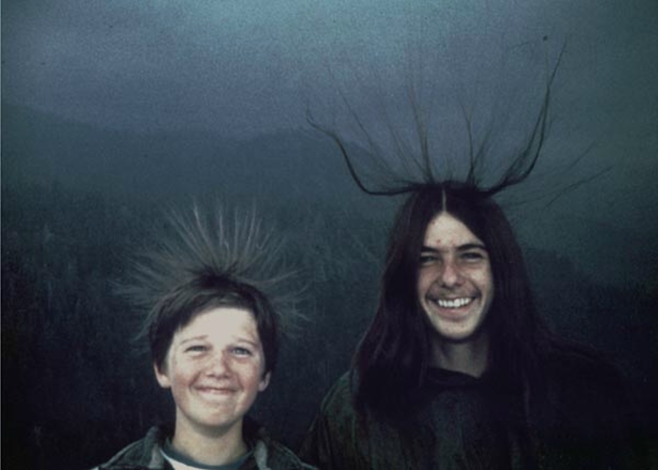 Hair standing on end is a tell tale sign of an electrical storm nearby. It was taken at Sequoia National Park in California during the summer of 1975. Both brother were struck by lighting. One of them suffered severe burns and committed suicide later.