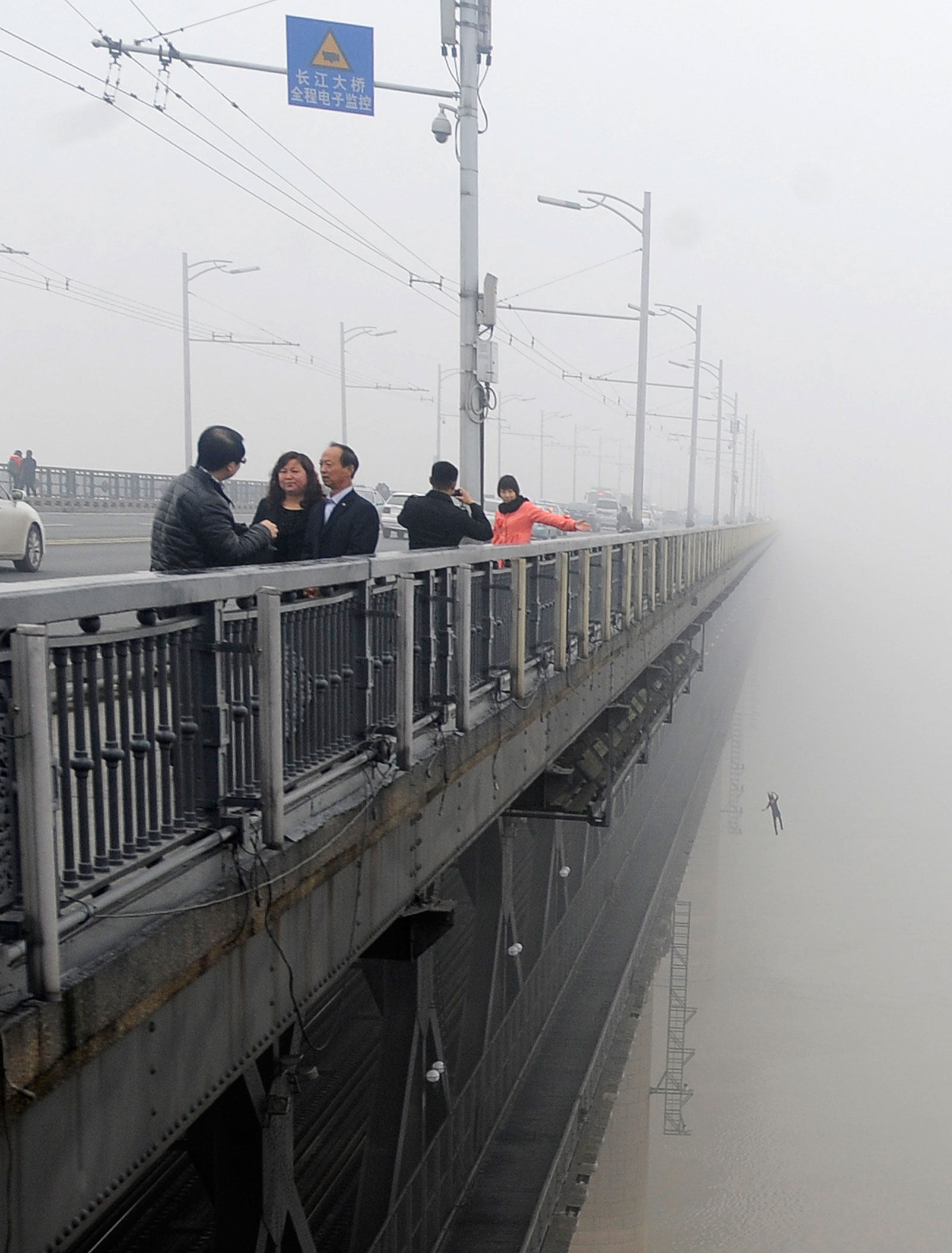 A photographer in China in 2013 accidentally captured the moment of a person jumping from a bridge to his death.
