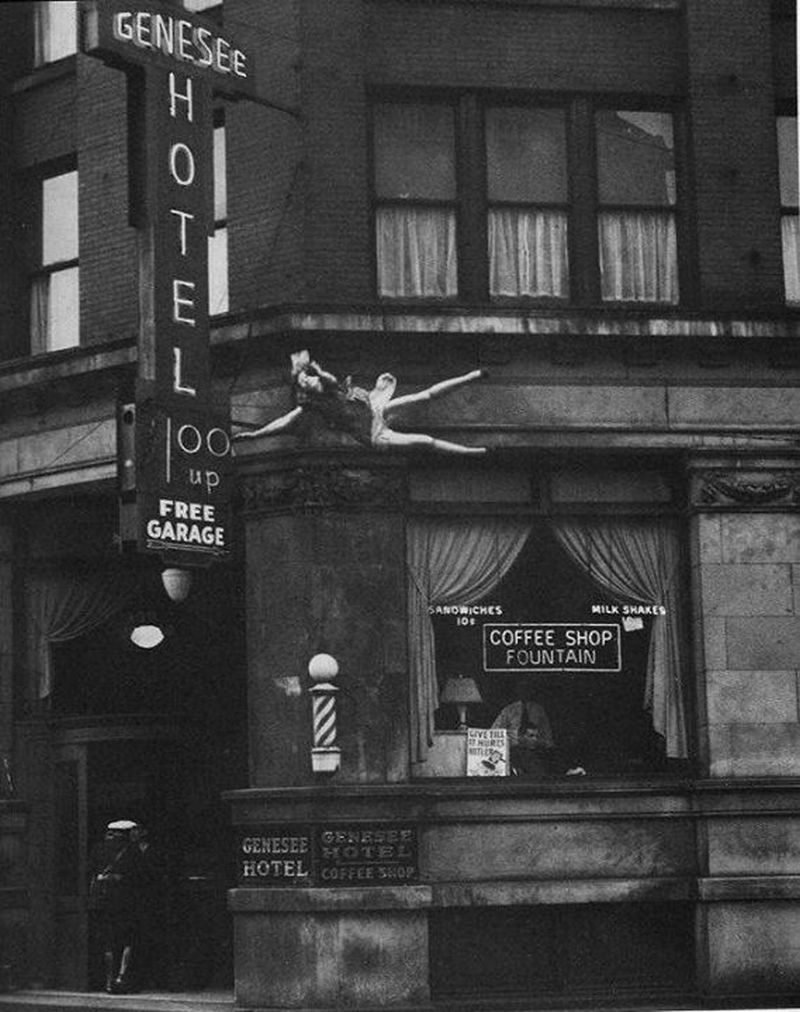 This photograph is of a woman moments before she hits the ground after jumping from the ledge of the Genesee Hotel in 1942.