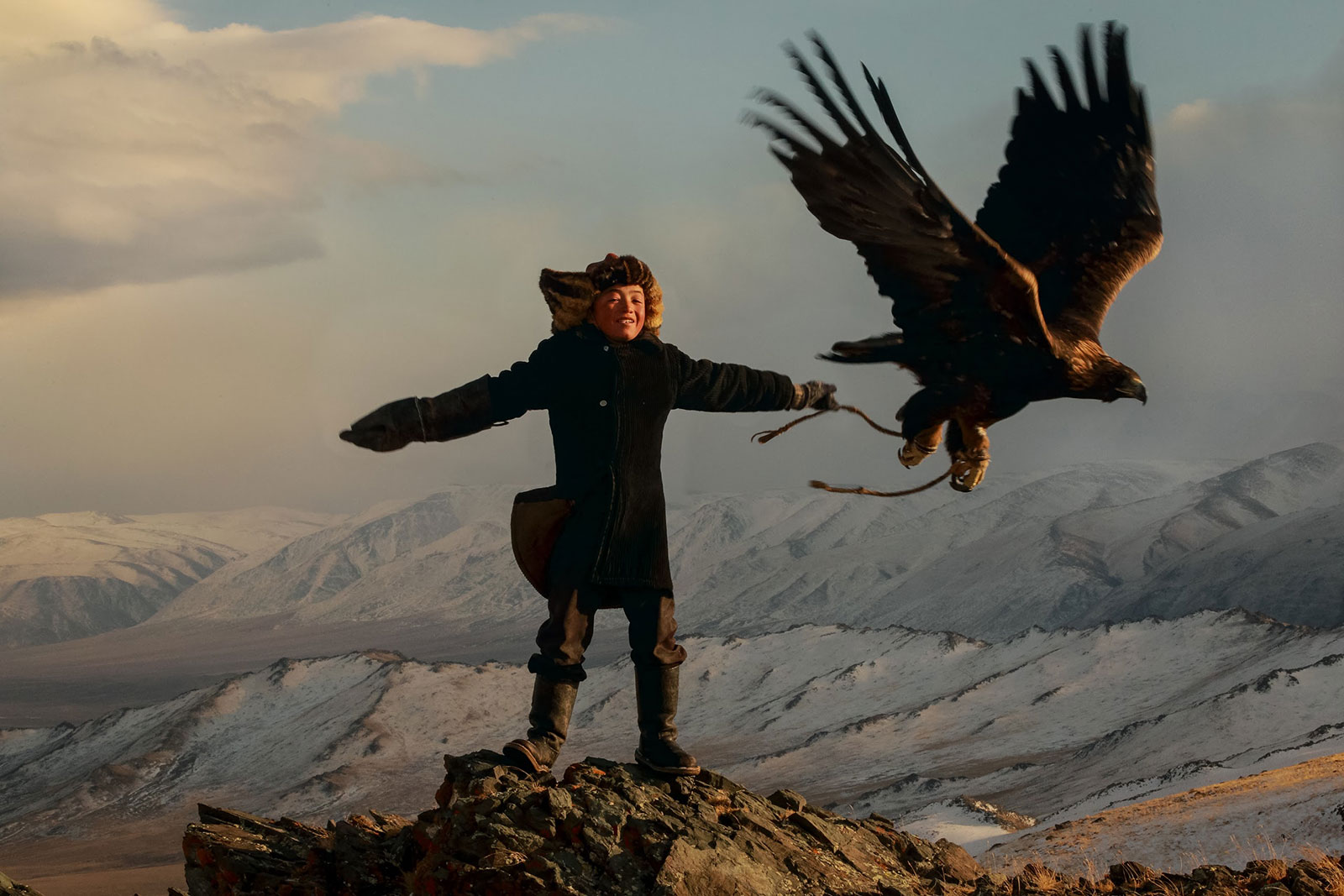 13 year old Mongol girl and her Golden Eagle.