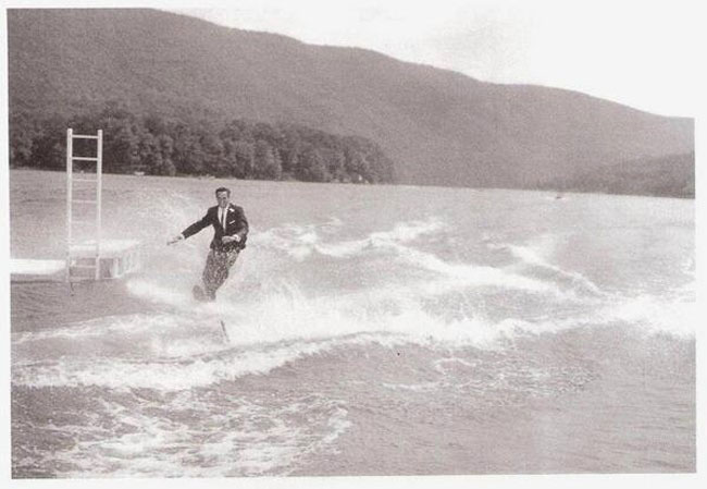 Man water skiing in a tux
