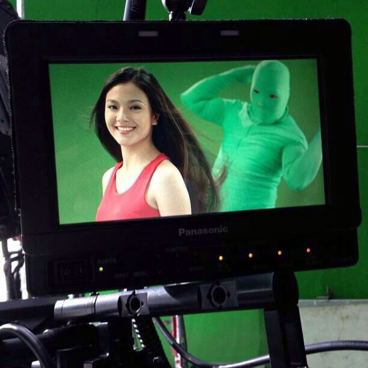 Greenscreen-clad workers who secretly flip models' hair during shampoo commercials