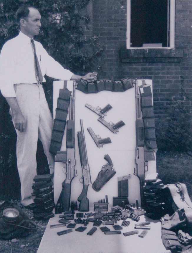 The arsenal of weapons and ammo discovered in the "death car" of Bonnie Parker and Clyde Barrow on May 23, 1934