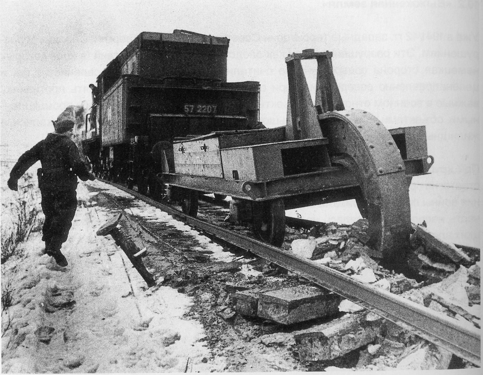 A railroad plough, also known as a Schienenwolf, "rail wolf", destroys Soviet train tracks as the Germans retreat. Winter 1943