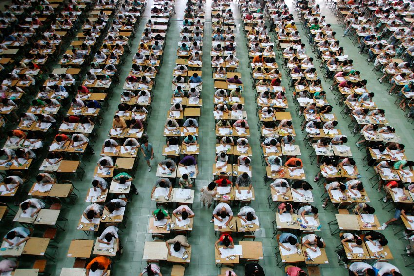 Students taking an English exam in an exam hall at Dongguan University in China. English is one of three main areas of testing, along with math and Chinese