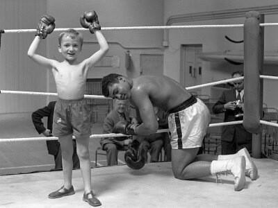 Muhammad Ali letting a young fan win a fight, 1963.