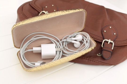 Keep loose chargers and cables organized with a glasses case.