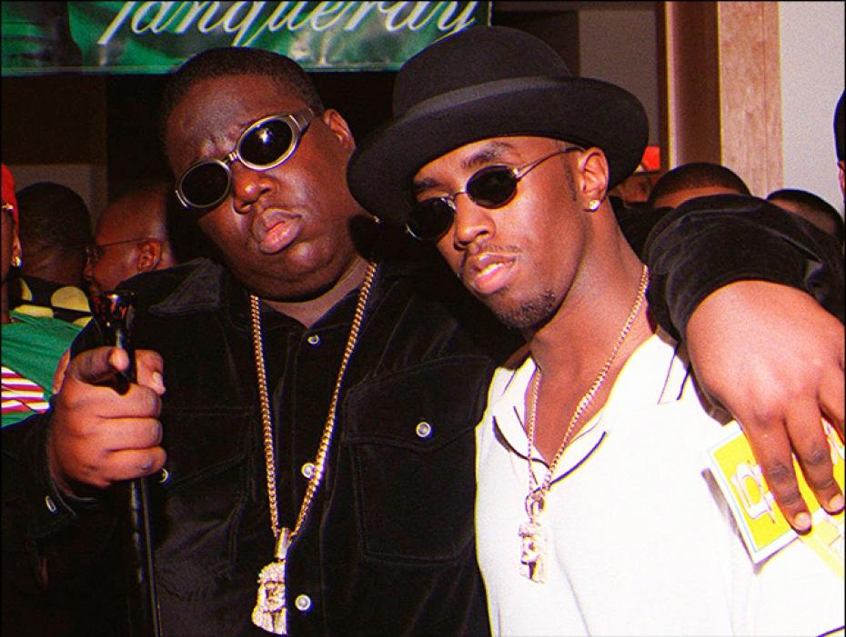 Biggie Smalls-This photo of Biggie Smalls, with close friend and collaborator Sean "P. Diddy" Combs, was taken right before his death after Biggie presented an award at the Soul Train Music Awards and left a party at the Petersen Automotive Museum on March 9, 1997. Leaving the party, Biggie was riddled with bullets in a drive-by-shooting and died.