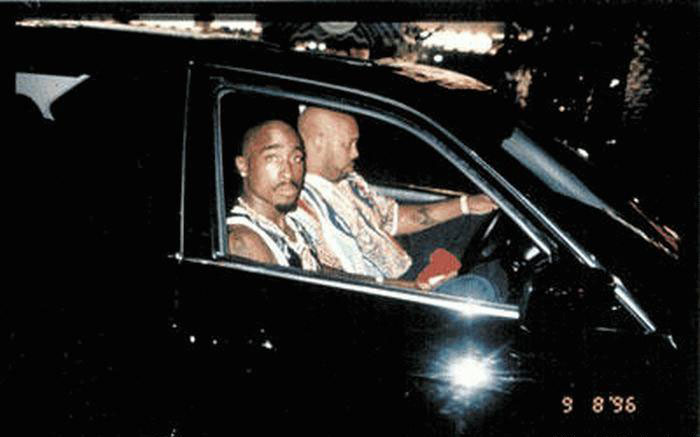 Tupac Shakur-Tupac's last photo sees him sitting beside his manager Suge Knight in a BMW right before he was shot to death in a drive-by-attack on Sept 13, 1996. The pair had just attended the Mike Tyson vs Bruce Sheldon fight at the MGM Grand in Las Vegas