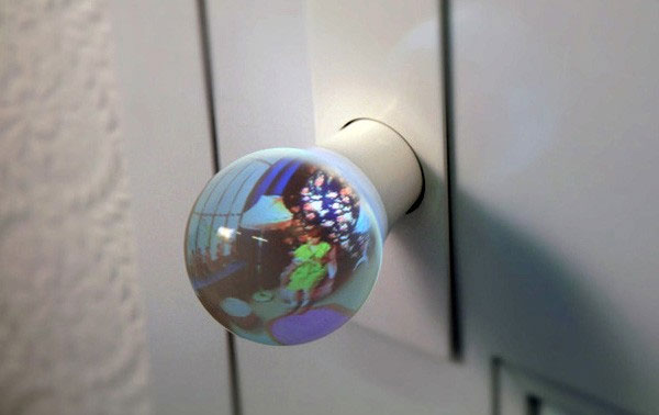 Door knob design that gives you a fish eye view of the room ahead.