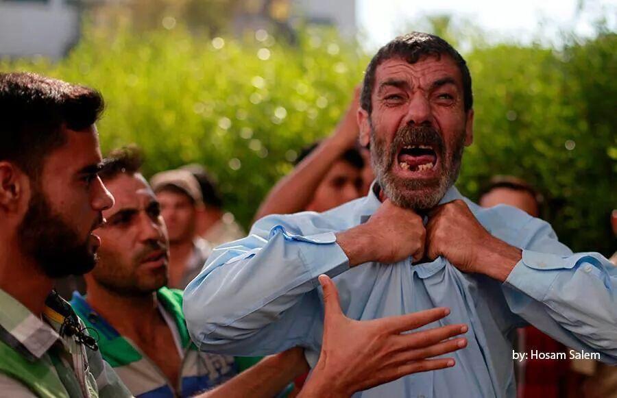 Here is father of 4 boys killed playing football in Gaza yesterday. They were not "human shields" but innocent children. Picture by Hosam Salem