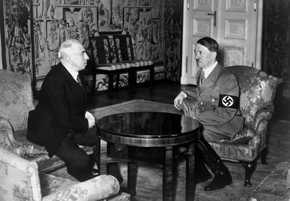 Adolf Hitler informs Czech President Emil Hacha of the imminent German invasion of Czechoslovakia on March 15, 1939 in Berlin. Hacha suffered a heart attack during the meeting, and had to be kept awake by medical staff, eventually giving in and accepting Hitler's surrender terms.