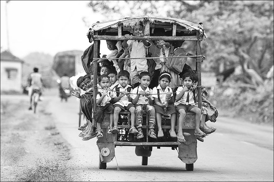 Riding a Tuktuk, 'Auto Rickshaw' to school In Beldanga, India