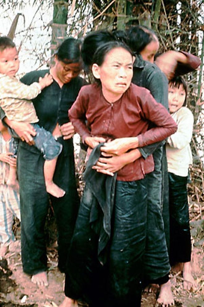 Vietnamese villagers, including children, huddle in terror moments before being killed by American troops at My Lai, Vietnam, March 16, 1968.