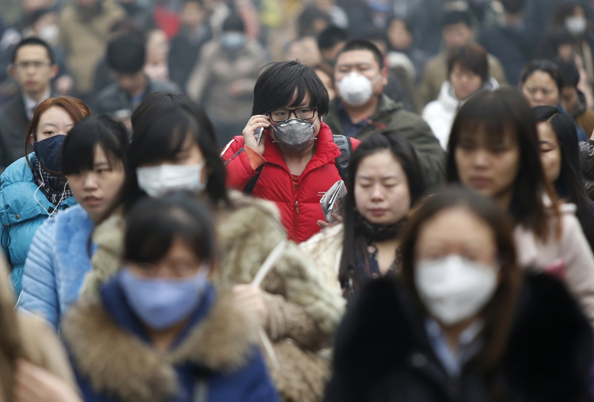 Beijing is also in the middle of a pollution crisis, forcing commuters to wade through thick smog on the way to work.