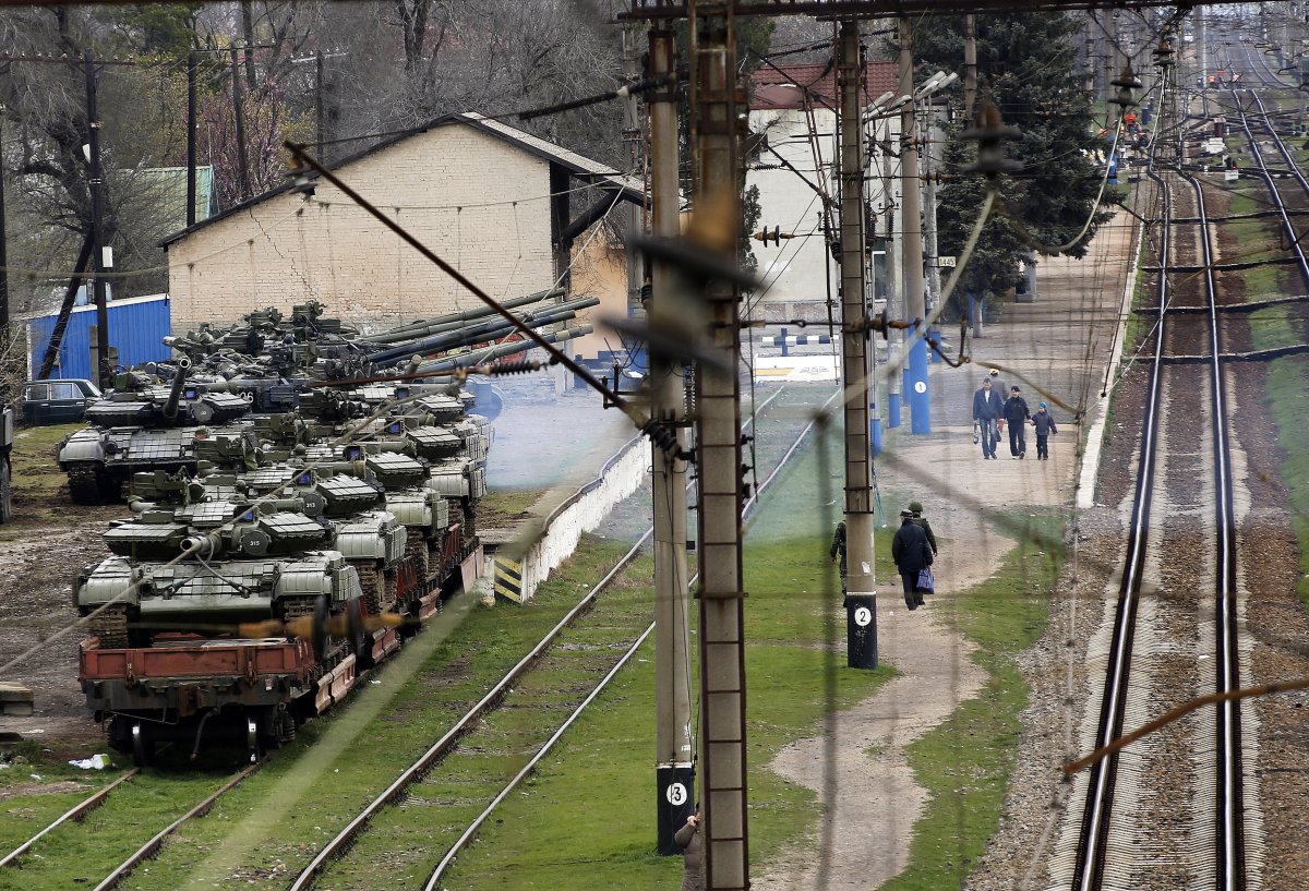 Getting to work in the Ukraine was a martial situation earlier this year. Notice the tanks ready to be shipped out by rail.