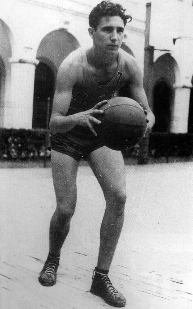 A 17-year-old Fidel Castro plays basketball at his High School in 1943.
