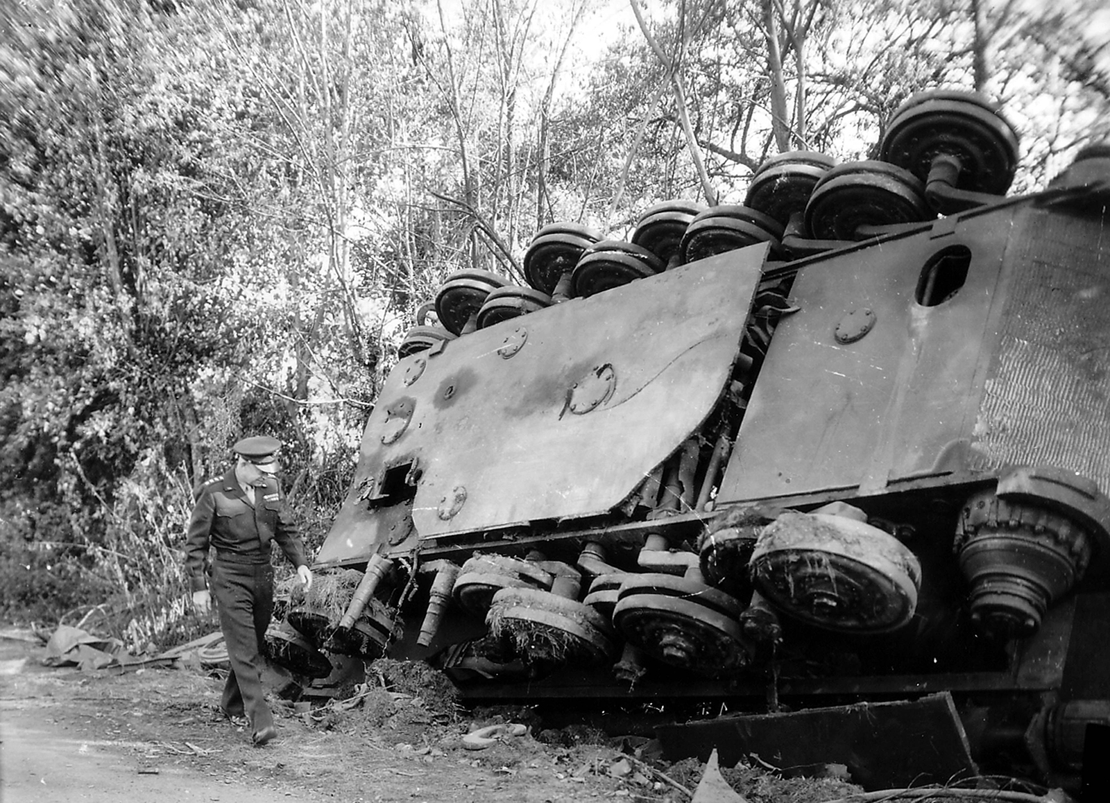 Dwight D. Eisenhower walking past a destroyed German Tiger Tank after the battle of Chambois, France 1944