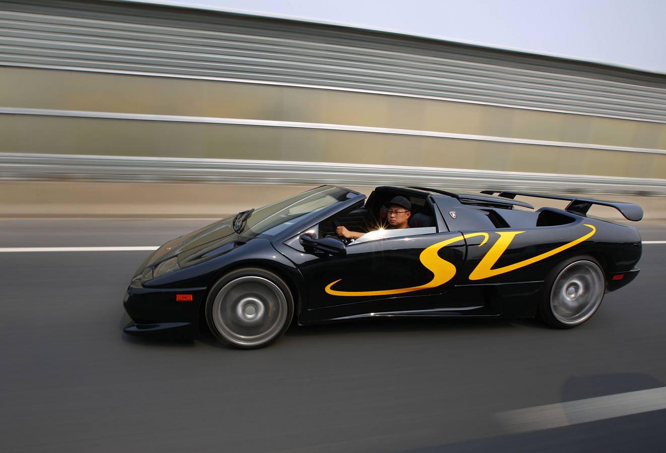 Wang Yu drives a handmade replica of Lamborghini Diablo on a highway during a test drive in Beijing. Chinese race car enthusiasts Wang Yu and his partner Li Lintao spent approximately 812,000 dollars on parts and workers, taking them six years to assemble the car using knowledge they gained from studying engineering for nearly a decade abroad. They sold their second Lamborghini replica to Alibaba as a collection.
