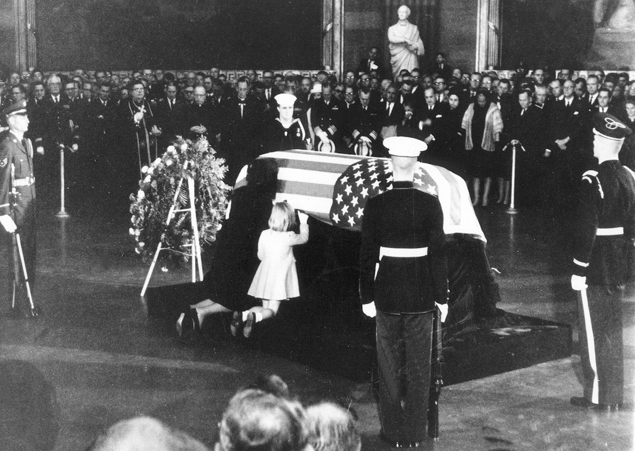 Jackie Kennedy kisses the casket of JFK in the Capitol rotunda. Nov. 24, 1963.