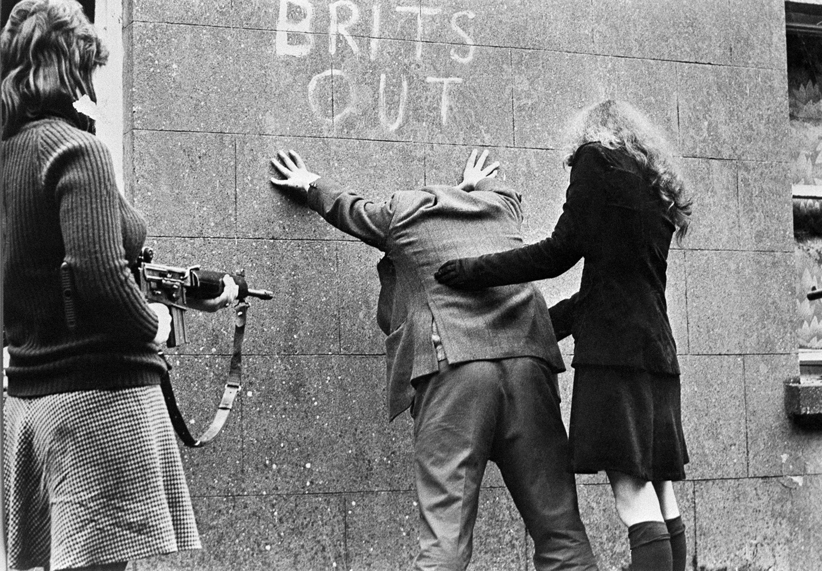 IRA girls searching a man, location and year unknown.