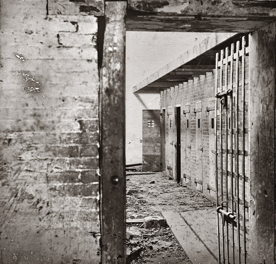 Slave Cells. Alexandria, Virginia c. 1865. Photograph shows interior view of a slave pen, showing the doors of cells where the slaves were held before being sold. Building address: 1315 Duke Street, Alexandria, VA.