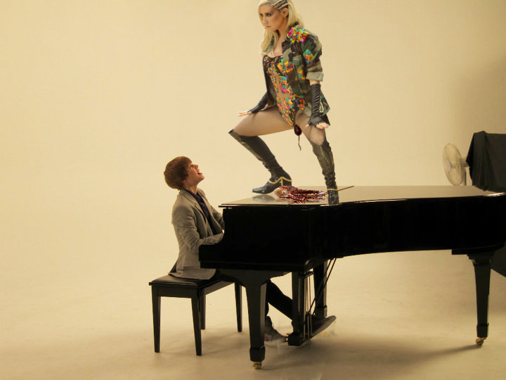 Kesha is giving birth to an alien baby on top of a piano while being serenaded by Justin Beiber.