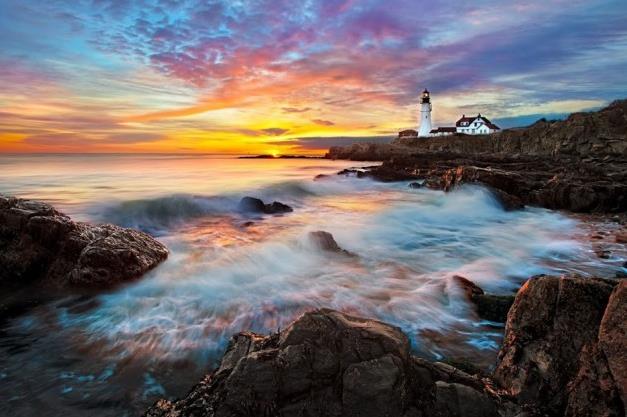 Lighthouse next to a beautiful sunset