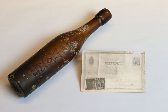 100-Year-Old Message In A Bottle Plucked From Baltic SeaIt contained a worn postcard from 1913. The text has not been fully deciphered. It was found this year, and was given to the Granddaughter of the man who made it, and she presented it to a museum. The stamps are of the german Empire. On the top it says Deutschland  germany.