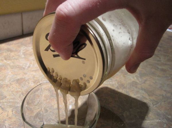 Punch holes in a mason jar to make an instant strainer.