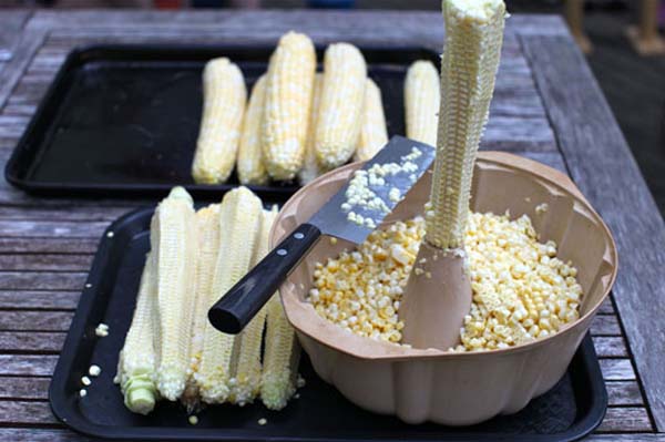 Use a bundt pan to stabilize a cooked ear of corn so you can cut off the kernels.