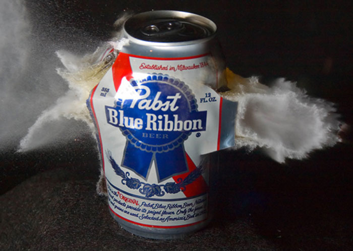 Hollow point bullet through a can of Pabst beer