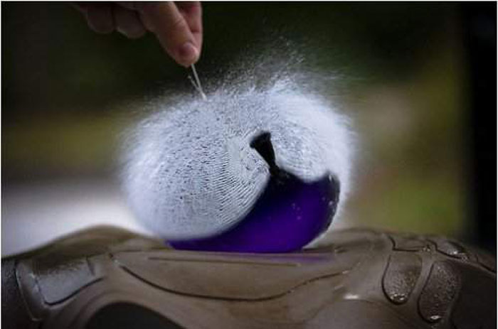 Water balloon pricked by a needle