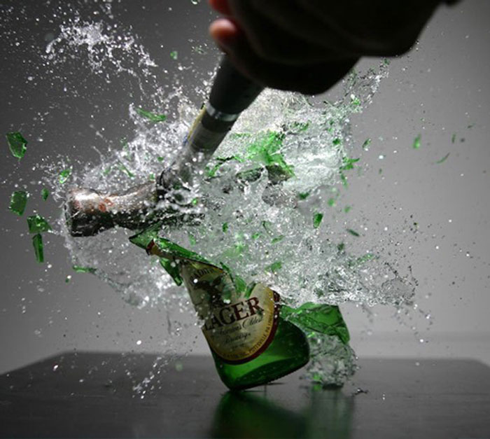 Hammer destroys a bottle of beer