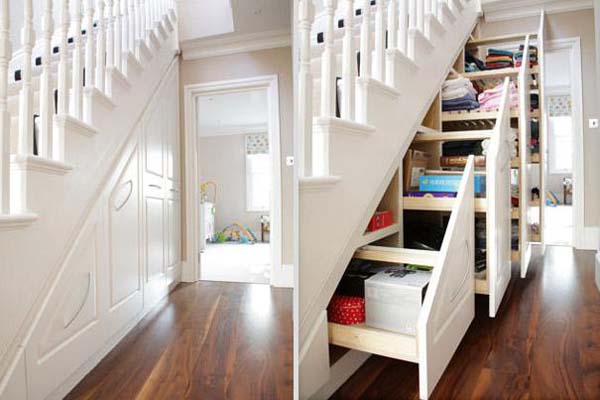 Use all of that extra space under the stairs as storage.