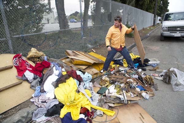 Gregory digs through illegally dumped trash and goes dumpster diving.