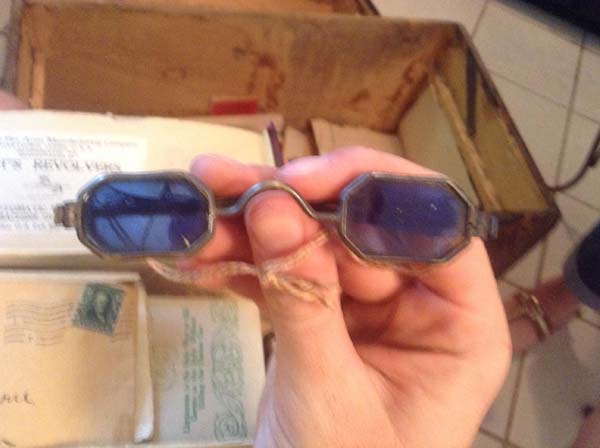 The blue tinted ones could have been sunglasses, or maybe even used to see hidden messages