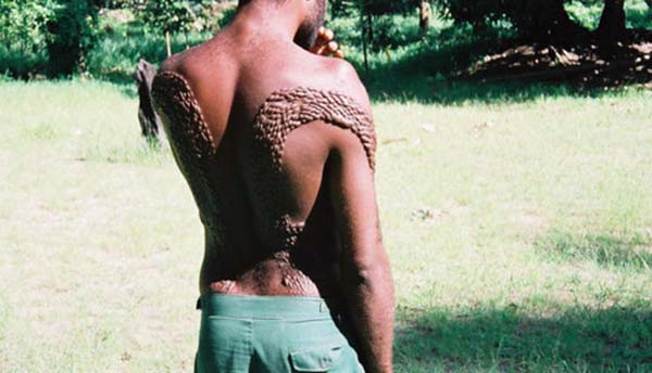 Scarification: This is done throughout the world, but the Sepik River tribes in Papua New Guinea use it as part of an initiation ceremony that lasts weeks and includes public humiliation. Elders use razor blades to cut the young men all over their bodies in a pattern that closely imitates the rough skin of an alligator, in hopes that the alligator will consume their youth.