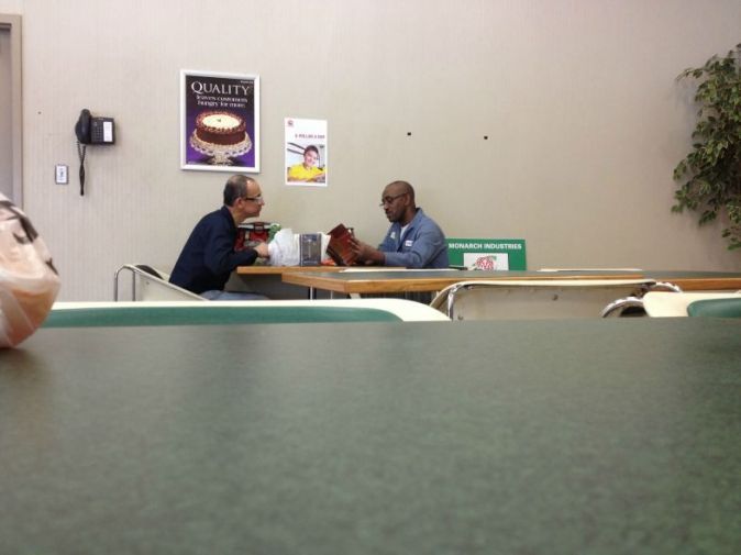 This man reads to his coworker who can't read each day.