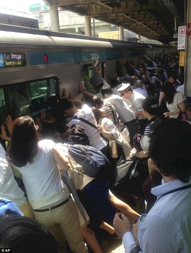 Japanese commuters save a woman who fell from train...Her life is saved, and the train is only 8 minutes late.