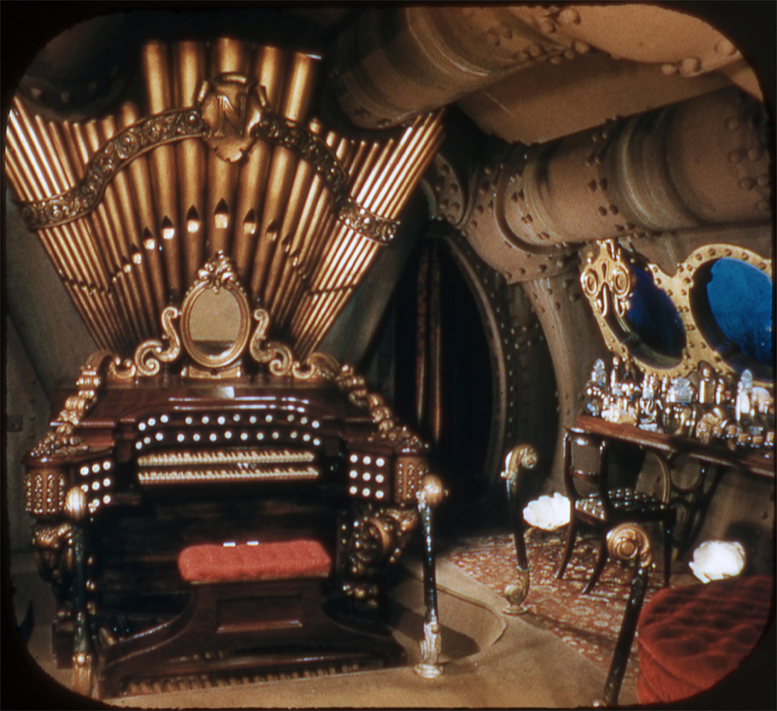 The huge organ in the Haunted Mansion is actually from a movie. Its the same organ seen inside the Nautilus in the movie 20,000 leagues under the sea.