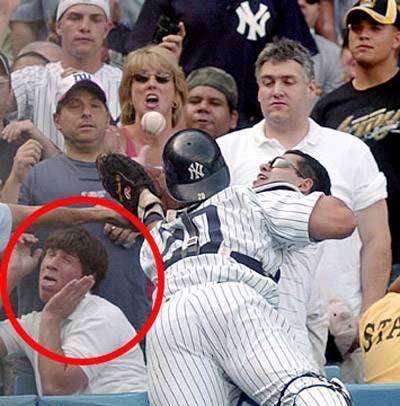 This Yankees fan  gets scared by the ball.  I guess thats why he quit after T-Ball.